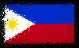 druppels water op de vlag van de Filipijnen achtergrond. ondiepe scherptediepte. selectieve aandacht. afgezwakt. foto