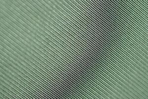 groene matte achtergrond van linnen stof, close-up. doek textuur .abstract groene achtergrond. foto