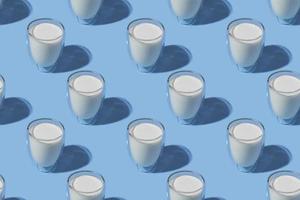 wereld melk dag. patroon op een blauwe achtergrond. een glas melk. patroon. foto