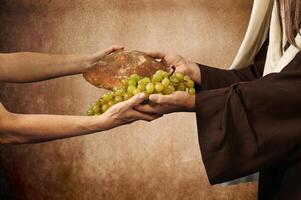 Jezus geeft brood en druiven foto