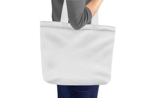 vrouw Holding een tote zak Aan wit achtergrond foto