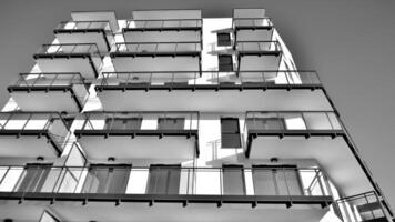 fragment van een facade van een gebouw met ramen en balkons. modern appartement gebouwen Aan een zonnig dag. facade van een modern appartement gebouw. zwart en wit. foto