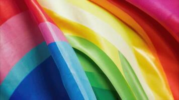 een dichtbij omhoog van een regenboog gekleurde kleding stof foto
