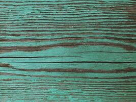 oud houten oppervlakte geschilderd met groen pellen verf net zo een achtergrond foto