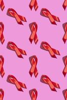 internationale aidsdag. rood lint met een harde schaduw op een roze achtergrond. helpt bewustzijn concept. verticaal. patroon