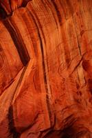 detail patronen en scheuren in rood Navajo zandsteen muren foto