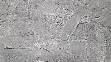 textuur van grijs decoratief gips of beton. abstracte achtergrond voor ontwerp. decoratief gipseffect op de muur. foto