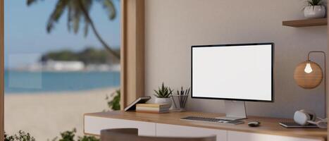 een minimaal, Scandinavisch huis kantoor met een computer Aan een tafel in de buurt de venster met een strand visie. foto