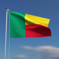 Benin vlag is golvend in voorkant van een blauw lucht met wazig wolken in de achtergrond foto
