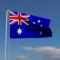 Australië vlag is golvend in voorkant van een blauw lucht met wazig wolken in de achtergrond foto