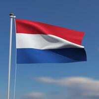 Nederland vlag is golvend in voorkant van een blauw lucht met wazig wolken in de achtergrond foto