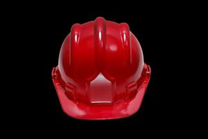 rood plastic werk helm Aan zwart achtergrond foto