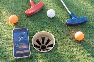 mini golf sport- wedden Aan een smartphone foto