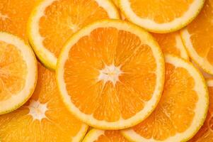 detailopname van gesneden sappig sinaasappels getextureerde achtergrond foto