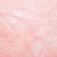 roze gerimpeld papier verfrommeld grunge abstract helder waterverf achtergrond. wijnoogst blanco zacht pale licht pastel kleur patroon ontwerp van oud roos structuur ruw vouw vel foto