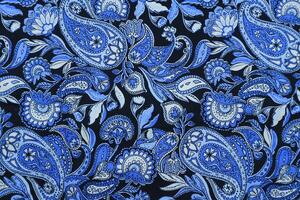 blauw paisley patroon kleding stof achtergrond foto