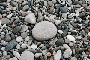 grindpatroon van gekleurde stenen. abstracte natuur kiezelstenen achtergrond foto