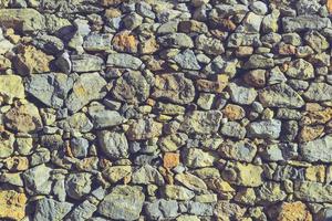 abstracte grijze steen vierkante muur realistische textuur ornament rots bouwen op de natuur. foto