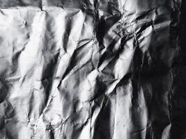 het oppervlak van aluminiumfolietextuur voor achtergrond- en ontwerpmaterialen. verfrommelde textuurcollectie van zilverfolie. abstracte gerimpelde patroonachtergrond foto