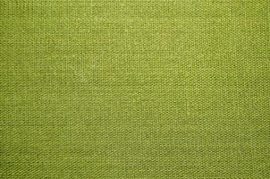 groene stof abstracte waterdruppel kleur vouwen fragment getextureerde oppervlak op canvas. foto