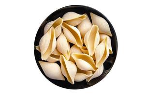 pasta conchiglie rauwe schaal gezonde maaltijd voedsel achtergrond foto