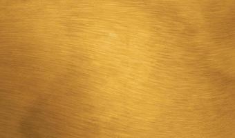 goudfolie textuur achtergrond met penseelstreken foto