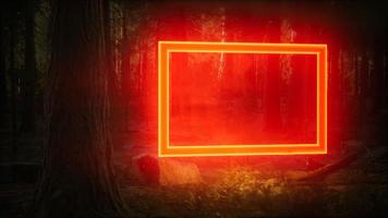 neon gloeiend rechthoekig frame in het nachtbos foto