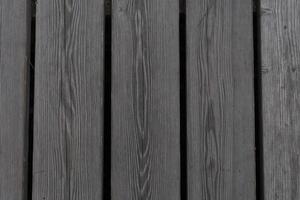 de textuur van verouderde planken is een close-up van een donkergrijze kleur foto