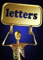 letters woord en gouden skelet foto