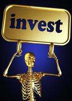 investeer woord en gouden skelet foto