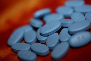 blauwe medische pillen close-up achtergrond hoge kwaliteit groot formaat print foto