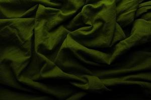 groene doek achtergrond en textuur, gegroefd van groene stof abstract foto