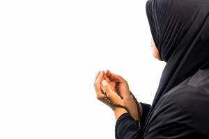 moslimvrouw die bidt voor allah, moslimgod foto