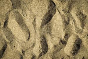 close-up zandtextuur op het strand als achtergrond foto