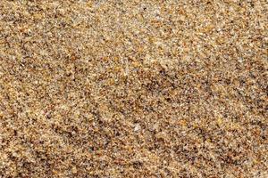zand grind textuur op het strand voor achtergrond. bovenaanzicht. foto