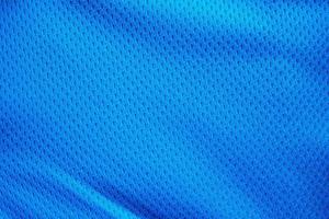 blauwe stof sportkleding voetbaltrui met luchtgaas textuur achtergrond foto