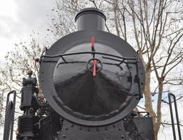 detail van het oude locomotiefvoertuig van de stoomtrein foto