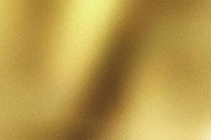 abstracte textuur achtergrond, licht schijnt op goud gegolfd metallic foto