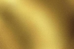 abstracte textuurachtergrond, glanzende gouden golfmetaalmuur foto