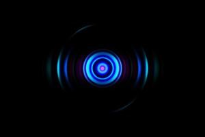 abstract gloeiend cirkel blauw lichteffect op zwarte achtergrond foto