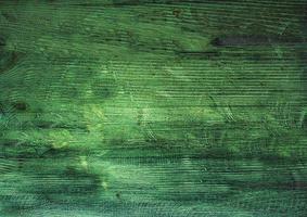 vintage groene houten achtergrondstructuur met knopen en spijkergaten. oude geschilderde houten muur. bruine abstracte achtergrond. vintage houten donkere horizontale planken. vooraanzicht met kopieerruimte foto