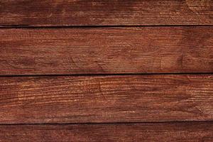 vintage bruin hout achtergrondstructuur met knopen en spijkergaten. oude geschilderde houten muur. bruine abstracte achtergrond. vintage houten donkere horizontale planken. vooraanzicht met kopieerruimte