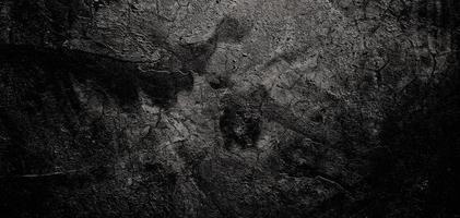 grungy cement textuur voor achtergrond, muur vol krassen. enge donkere muur foto