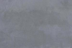 grijs beton, gladde grijze cementachtergrond. foto