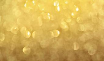 abstracte gouden glitter kerst licht bokeh achtergrond. foto