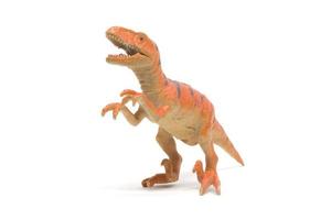 plastic velociraptor speelgoed geïsoleerd op een witte achtergrond foto