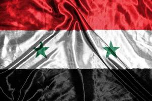 syrië doek vlag satijnen vlag wuivende stof textuur van de vlag foto