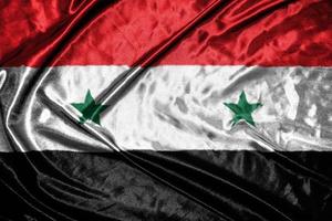 syrië doek vlag satijnen vlag wuivende stof textuur van de vlag foto