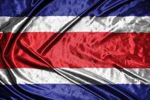 costa rica doek vlag satijnen vlag wuivende stof textuur van de vlag foto