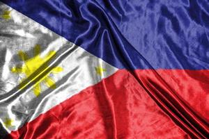 filippijnen doek vlag satijnen vlag wuivende stof textuur van de vlag foto